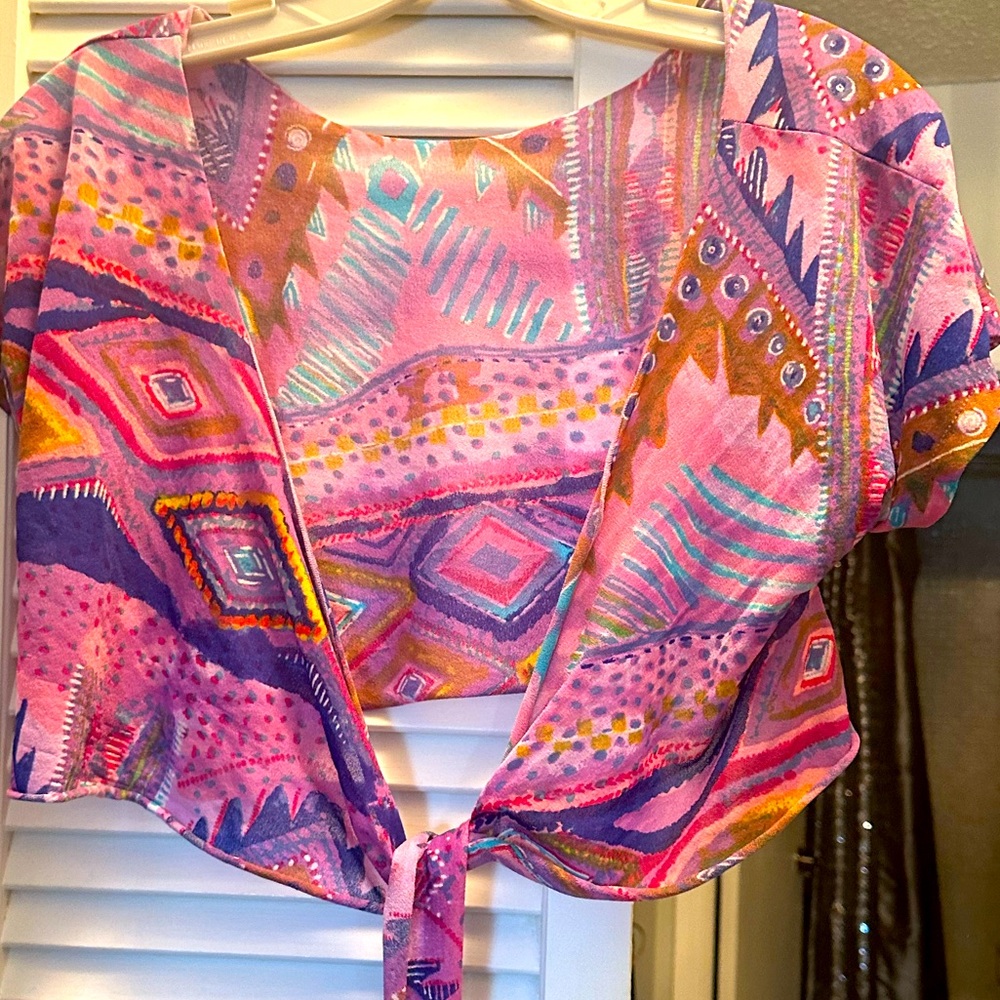 Sarong top and skirt pull on with mini skirt attached.